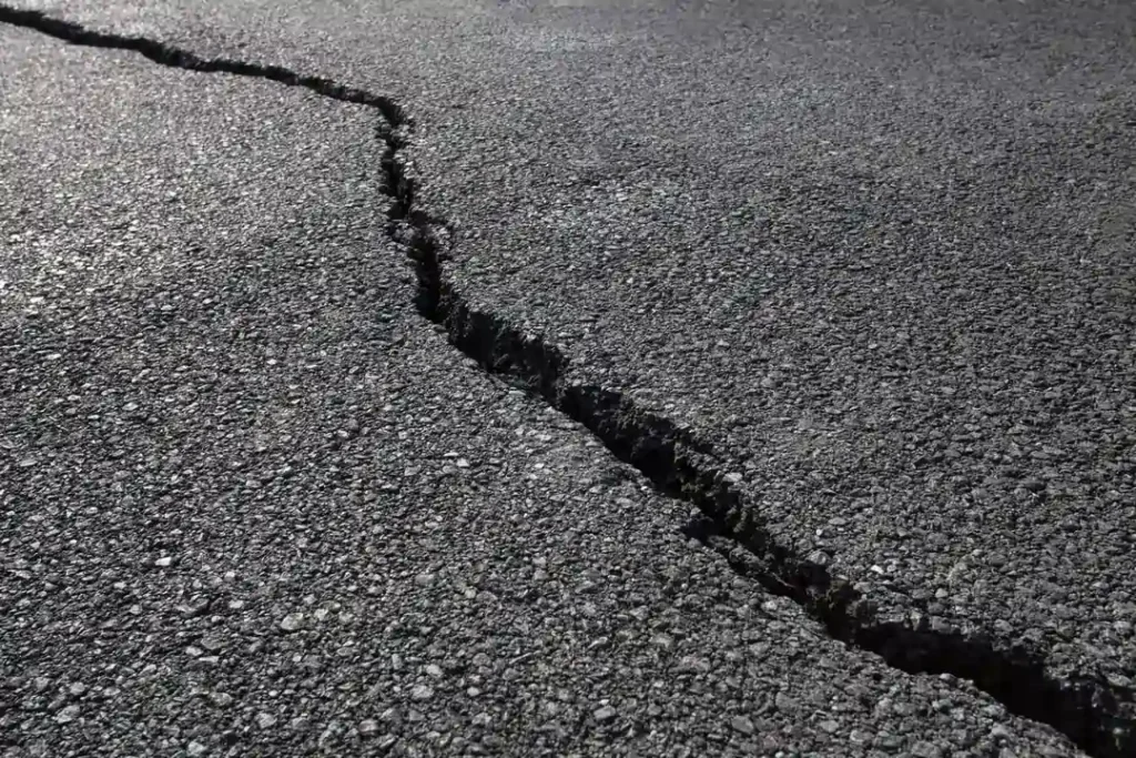 Large crack in asphalt pavement