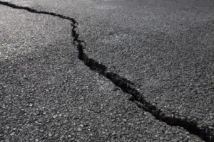 Large crack in asphalt pavement