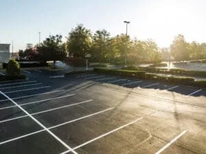 Sun shining down over freshly striped parking lot