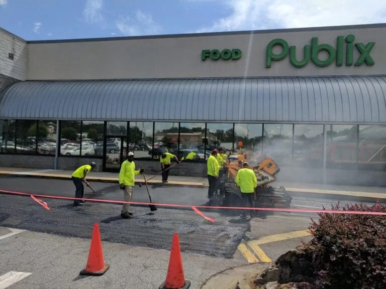 Blackjack Paving Contractors Laying Fresh Asphalt Down Outside of a Publix