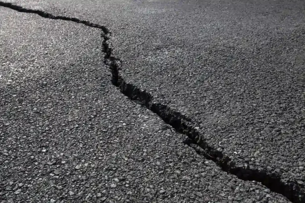 Large crack in asphalt pavement