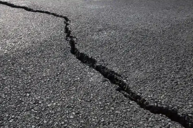 Large crack in asphalt pavement